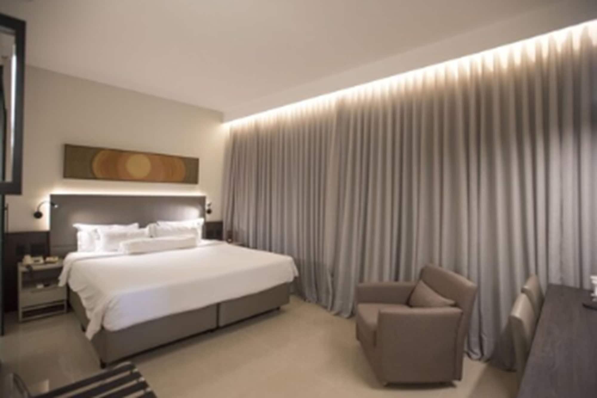 Royal Boutique Savassi Hotel Belo Horizonte Luaran gambar A bedroom at the hotel